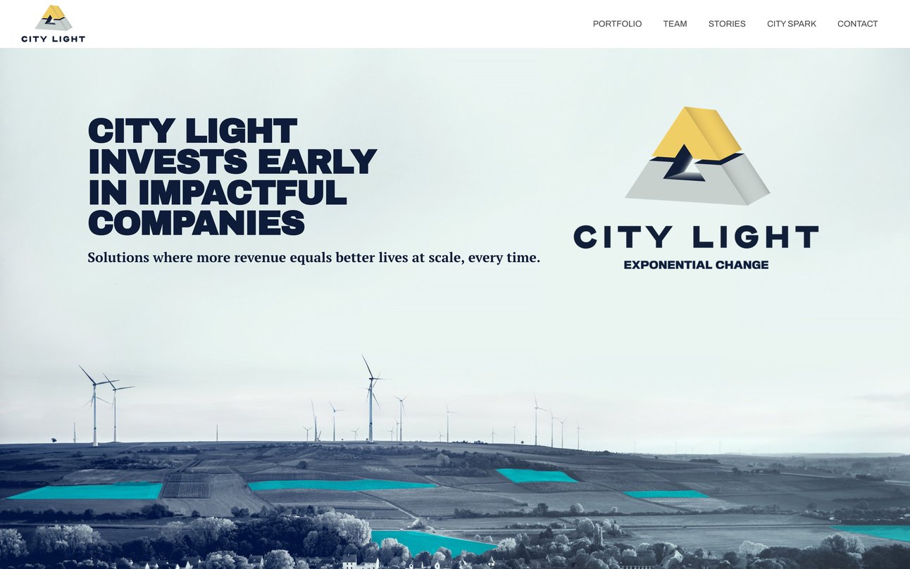 The City Light home page before: City Light invests early in impactful companies, in heavy capitals beside the dimensional logo, over a photograph of wind turbines
