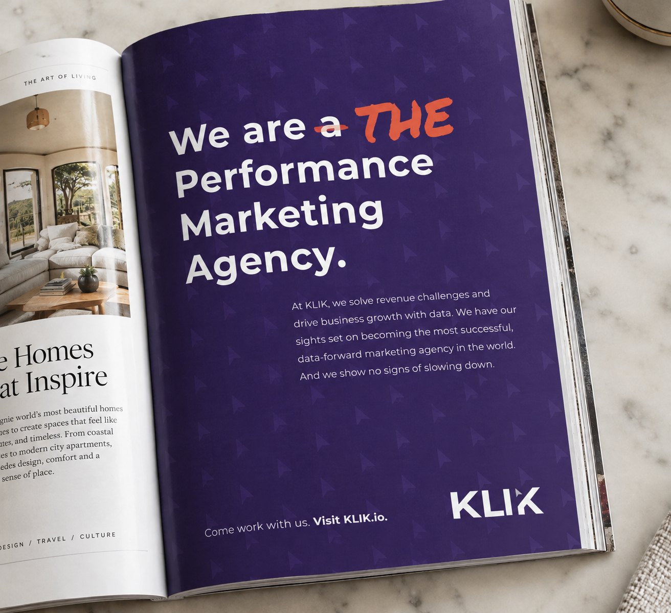 The KLIK print ad open in a magazine: we are a, crossed out, THE performance marketing agency