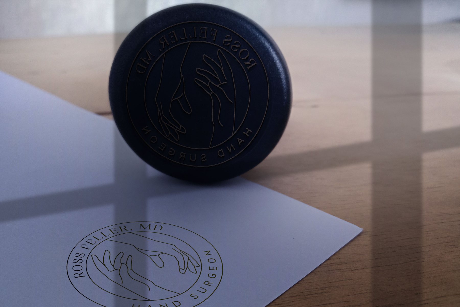 A stamp of the round Ross Feller, MD seal, pressed onto paper