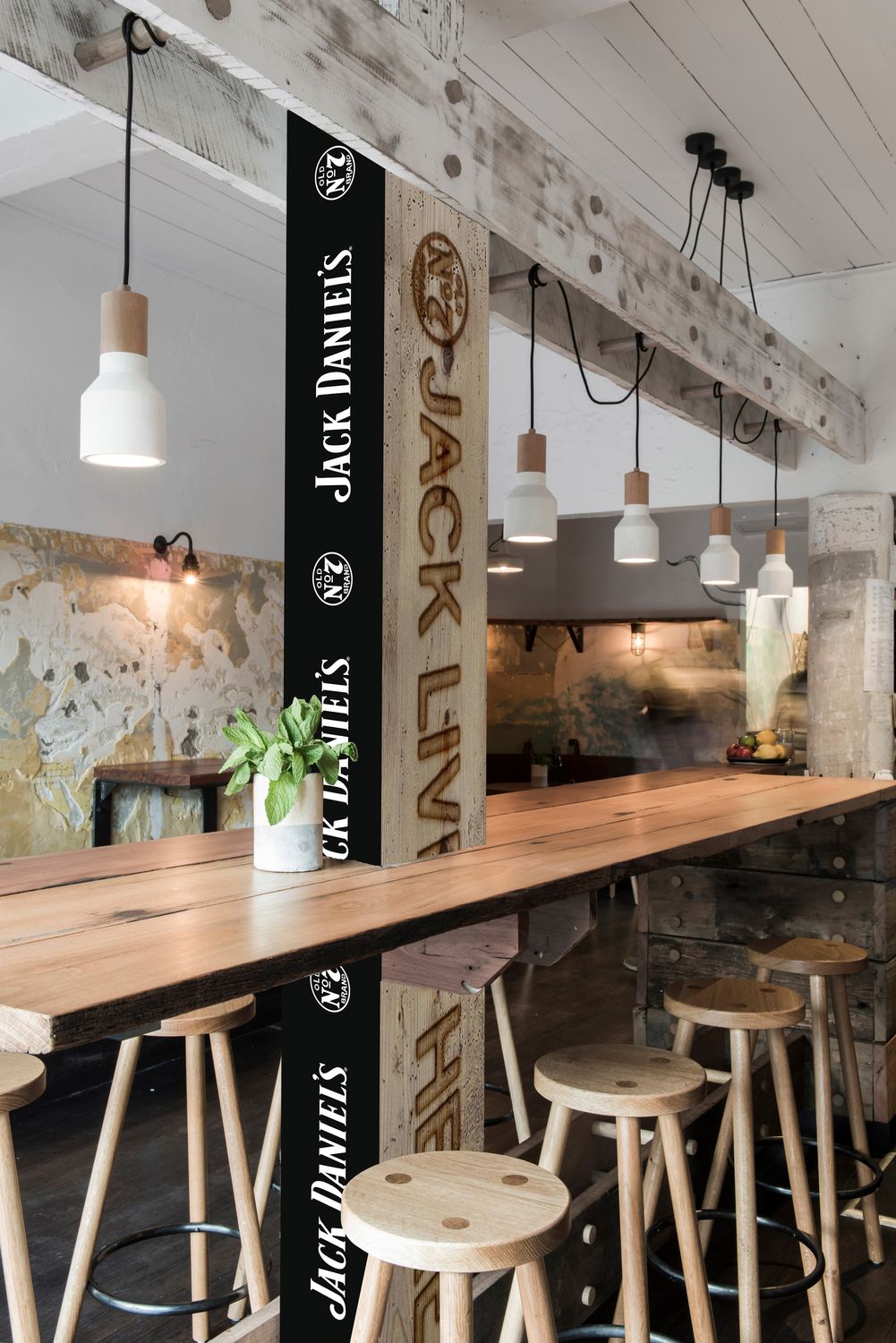 A bar column wrapped in Jack Daniel’s branding